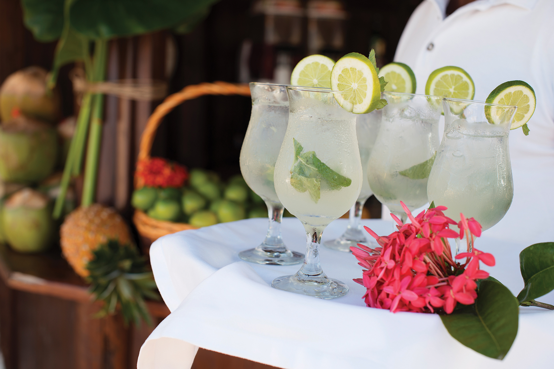 Cocktails at the beach with concierge services at Beloved Playa Mujeres
